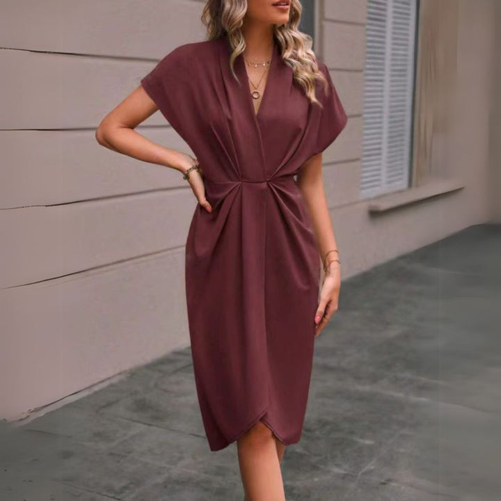 Chic women's V-neck midi dress with dolman sleeves, ideal for versatile professional and smart casual office wear.