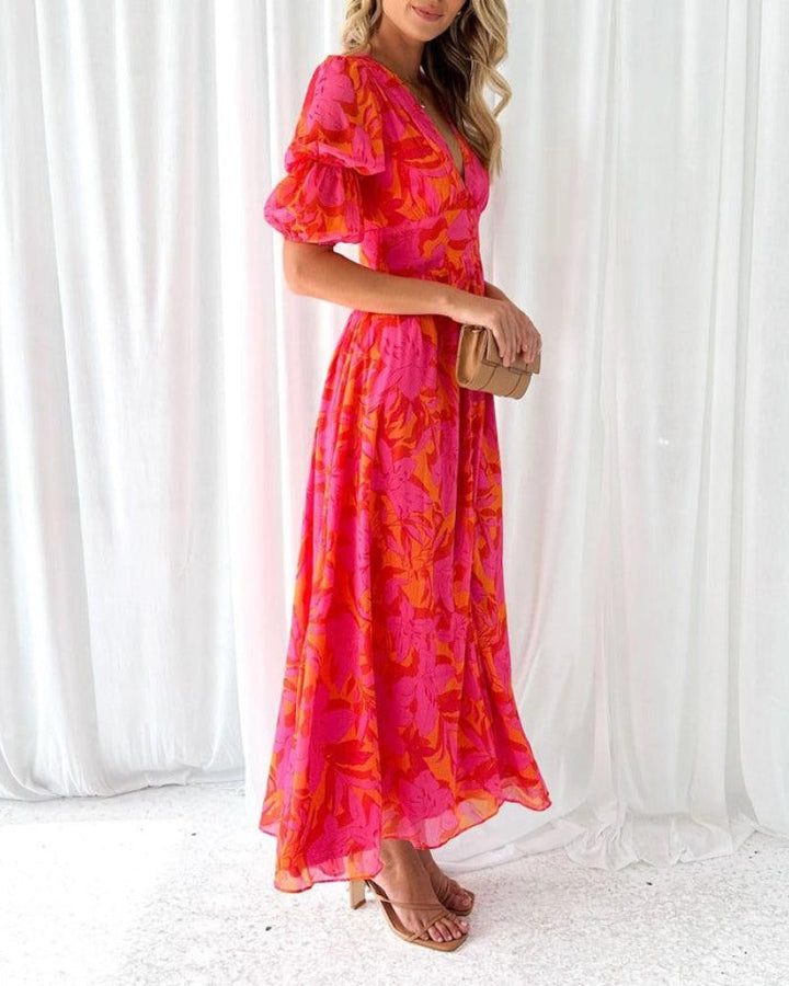 Chic women's V-neck maxi dress with elegant puff sleeves & long flowy skirt. Ideal for events.
