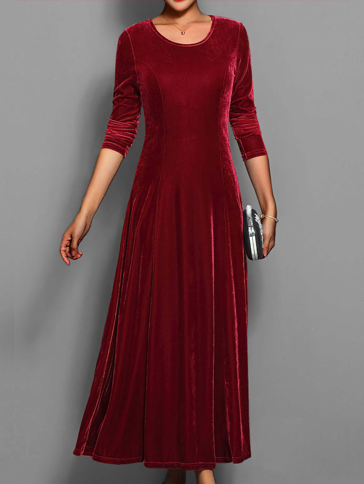 Elegant women's velvet midi dress with long sleeves, perfect for formal evening parties and events.