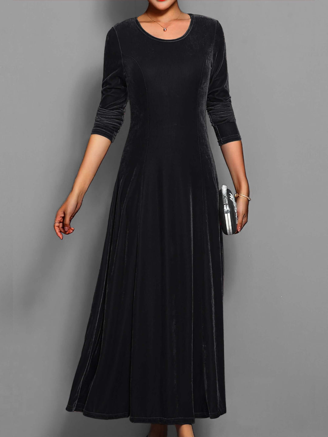 Chic women's velvet midi dress with long sleeves, offering elegant style and comfortable fashion for evenings.