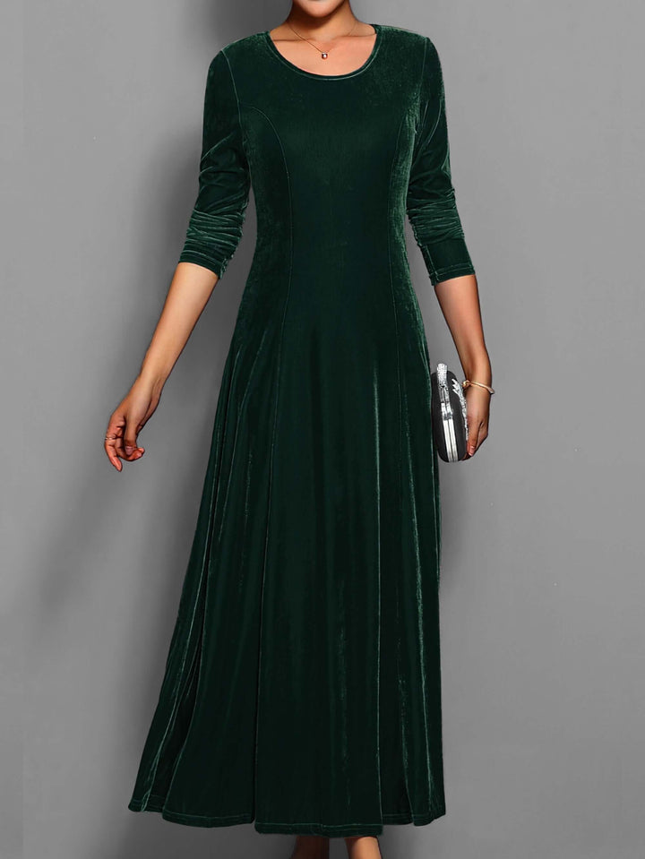 Plush velvet women's midi dress with long sleeves, an elegant and comfortable evening wear option for formal galas.