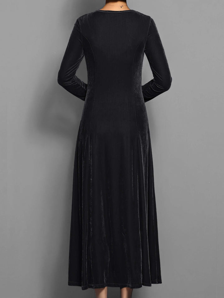 Beautiful women's long sleeve velvet midi dress, featuring luxurious fabric and a sophisticated cut for formal wear.