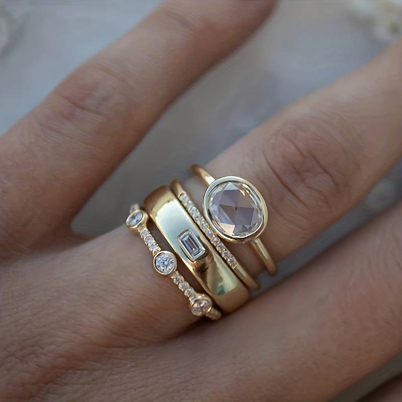 Elegant women's vintage gold ring set with sparkling zirconia. Perfect stacking rings, a fashionable dainty jewelry gift.