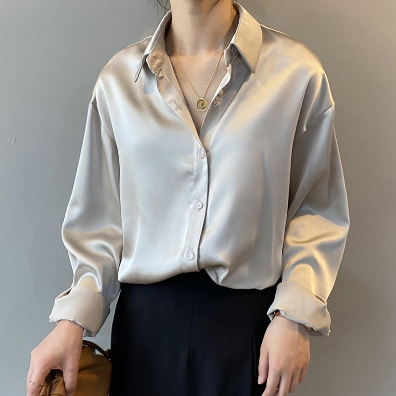 Soft, luxurious women's silk blouse, vintage design with a comfortable tailored fit. Elegant fashion top.