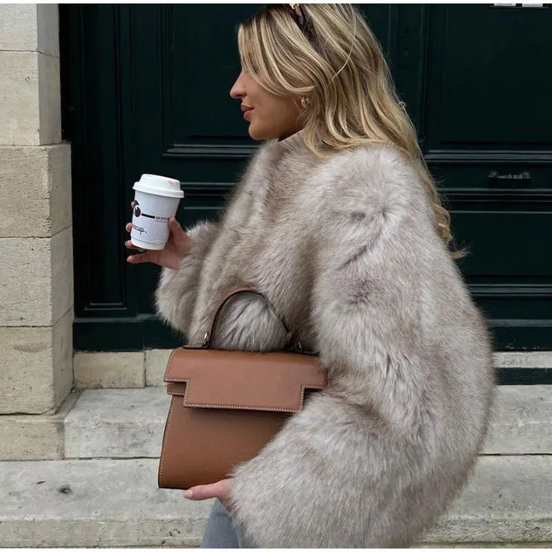 Elegant women's warm winter jacket in a classic style, perfect for cozy and stylish fall/winter outerwear.