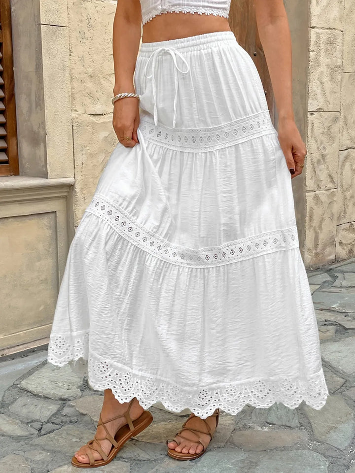 Long white lace maxi skirt for women, flowy and elegant, ideal for summer casual or bohemian style.
