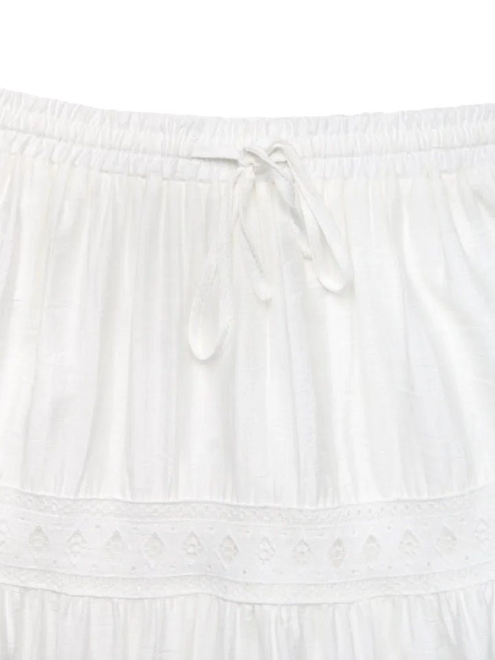 Chic women's white lace maxi skirt, elegant, flowy & long. Ideal for summer, bohemian, vacation, or casual style.