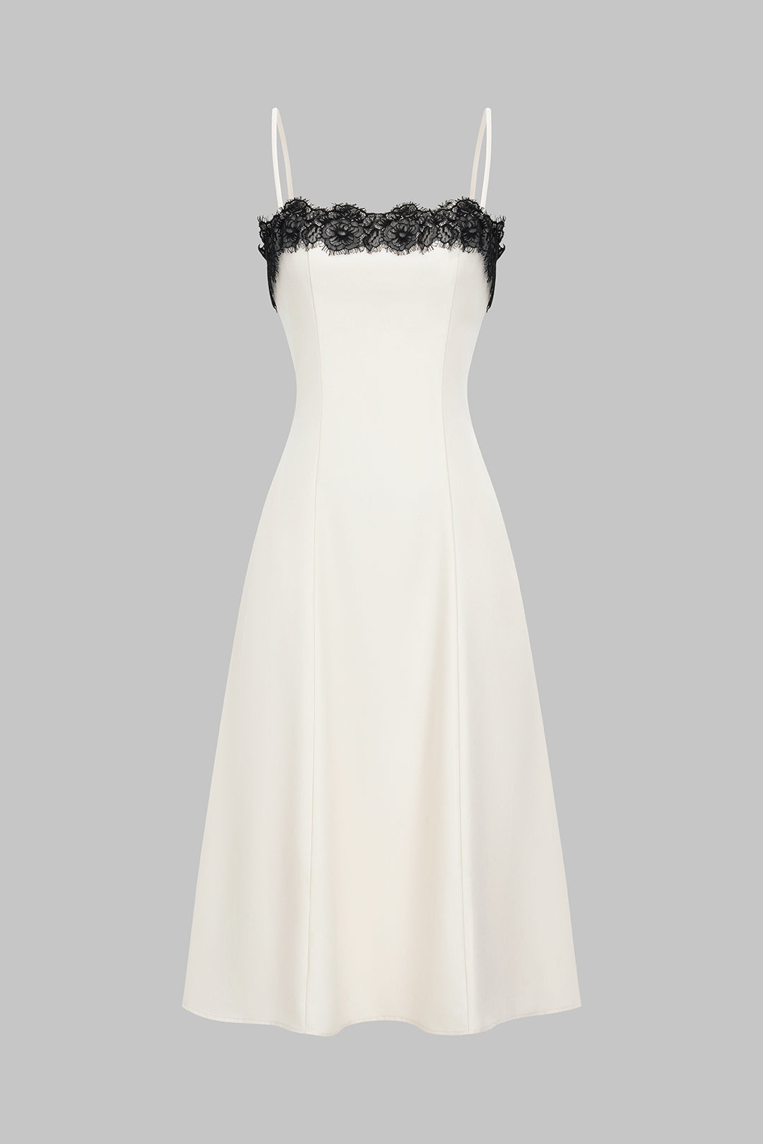 Elegant women's white midi dress with sophisticated black lace detail, perfect for evening events & special occasions.