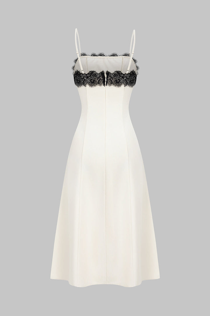 Stylish white midi party dress for women, featuring chic black contrasting lace detail for a sophisticated look.