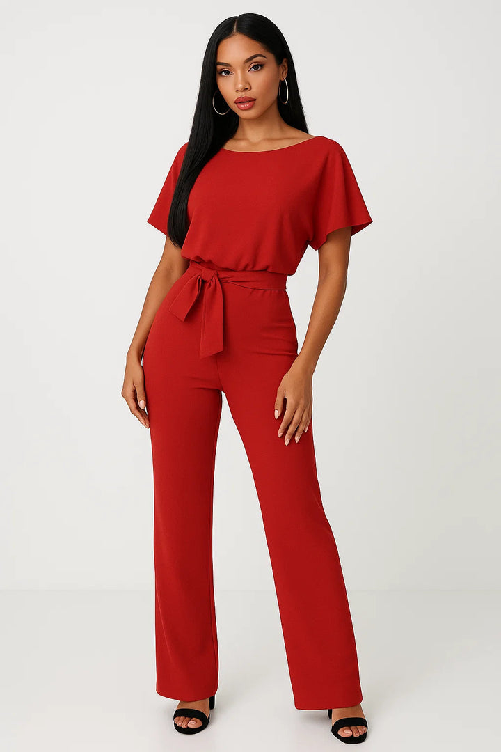 Fashionable women's wide-leg belted jumpsuit, versatile & comfortable for elegant spring/summer style.