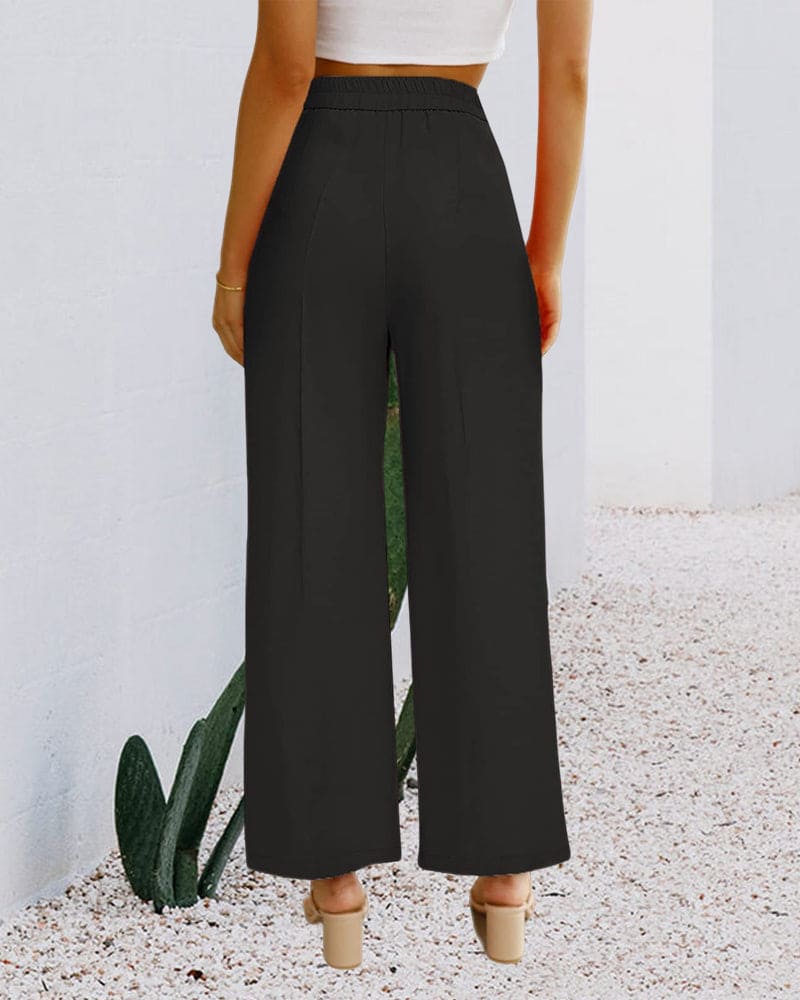 Side view of elegant women's wide-leg pants, highlighting the comfortable, stylish high-waist design.