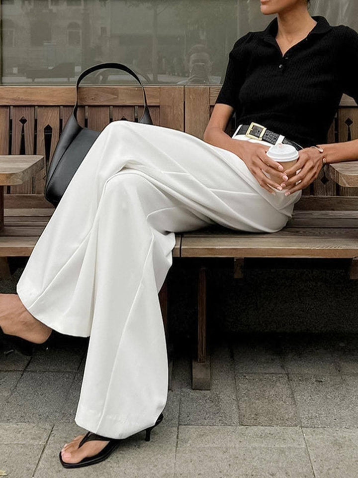 Modern women's wide-leg pleated pants, elegant bottom wear for a sophisticated look.