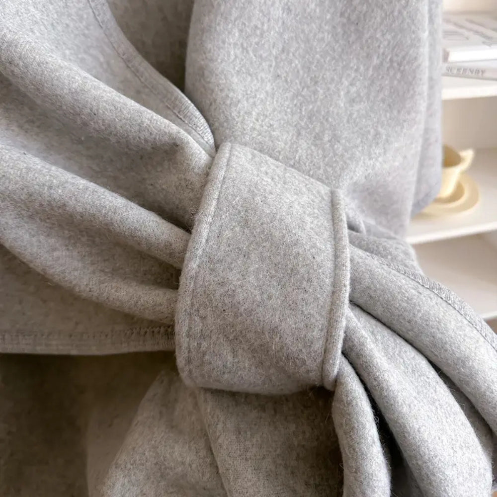 Fashionable women's elegant poncho shawl coat, ideal windproof outerwear for stylish winter looks.