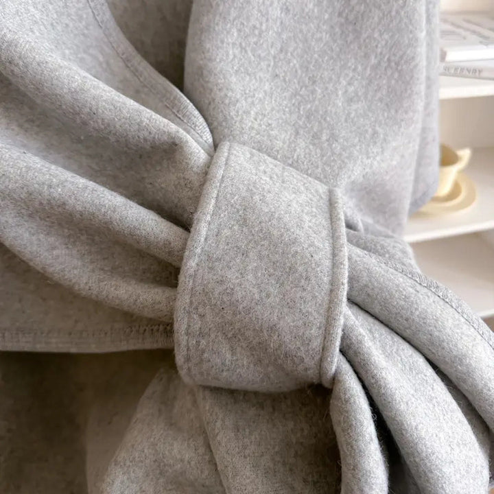 Fashionable women's elegant poncho shawl coat, ideal windproof outerwear for stylish winter looks.