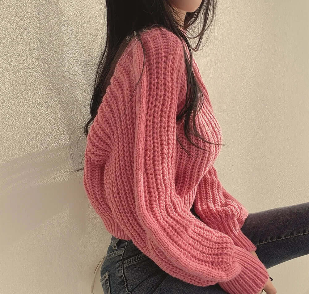 Warm women's crewneck sweater, long sleeve. Chic and elegant winter fashion apparel.