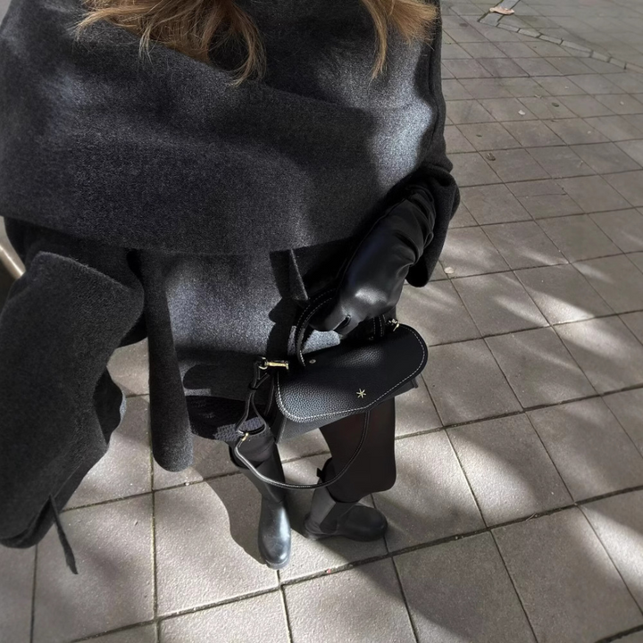 Cozy oversized women's winter poncho, a stylish warm wrap & essential fashion accessory.