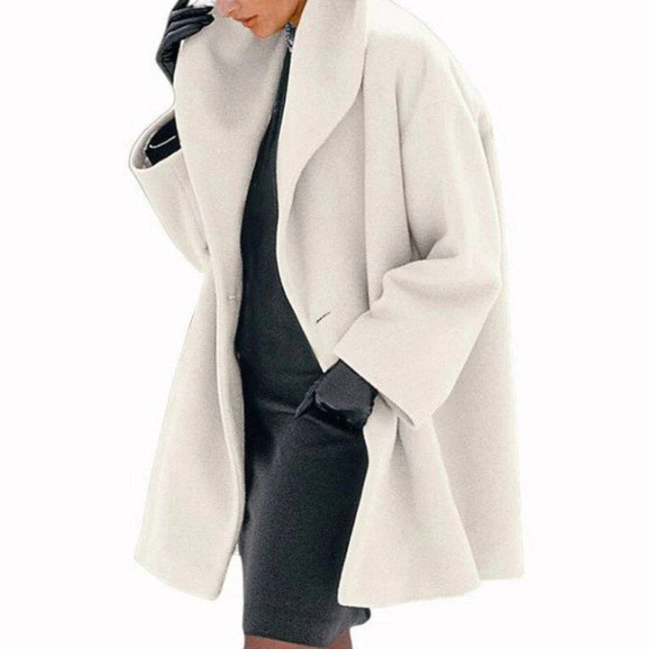 Elegant women's wool winter jacket, perfect for staying warm & stylish. Hip-length button-down outerwear.