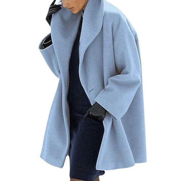 Warm women's wool jacket for winter. Stylish, cozy fall fashion outerwear with elegant button-down design.
