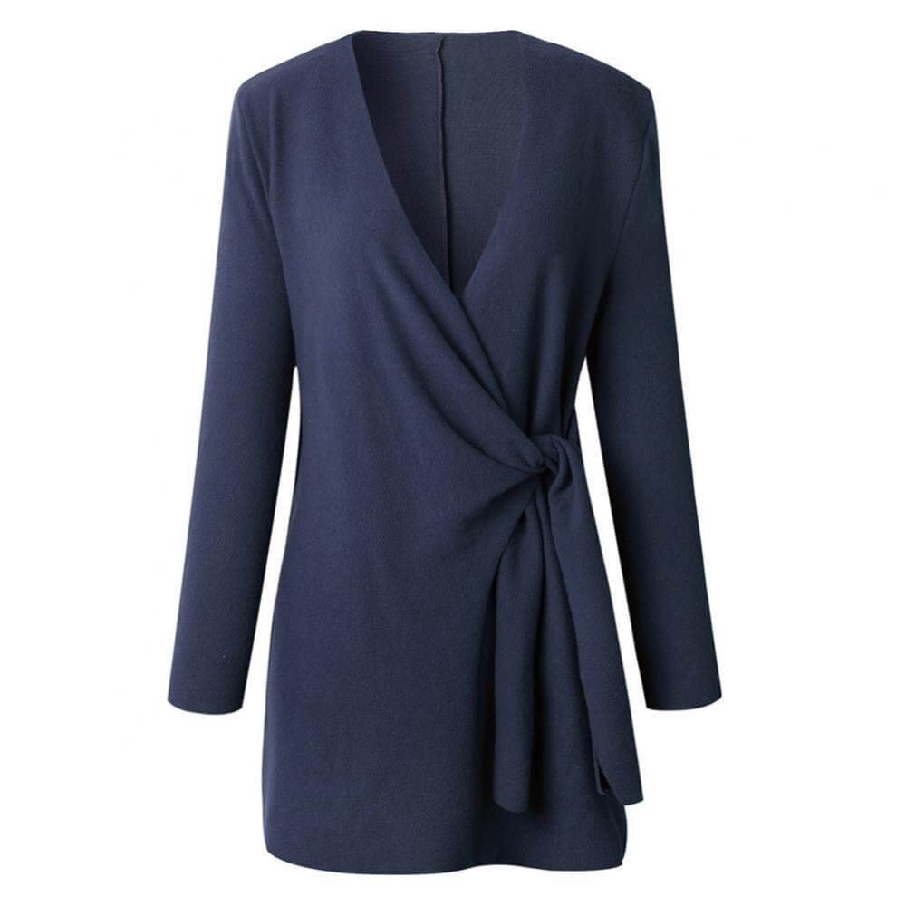 Detail of a women's elegant wrap dress, showcasing its flattering midi length & versatile design.