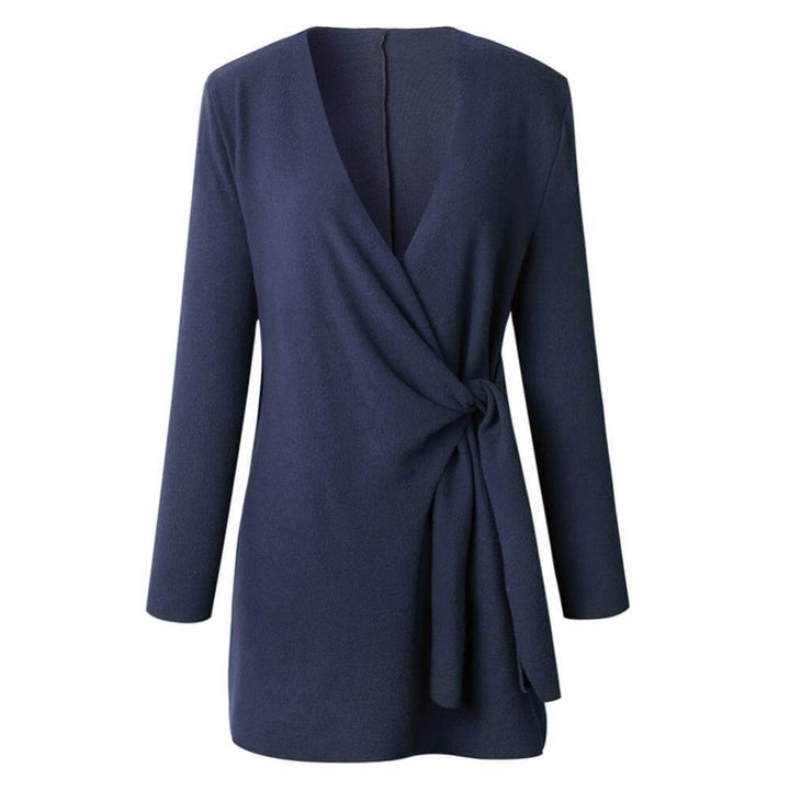 Detail of a women's elegant wrap dress, showcasing its flattering midi length & versatile design.