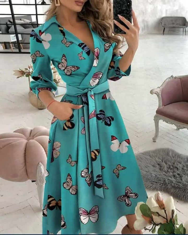 Elegant women's wrap midi dress in a flattering silhouette, perfect for evening wear or formal events.