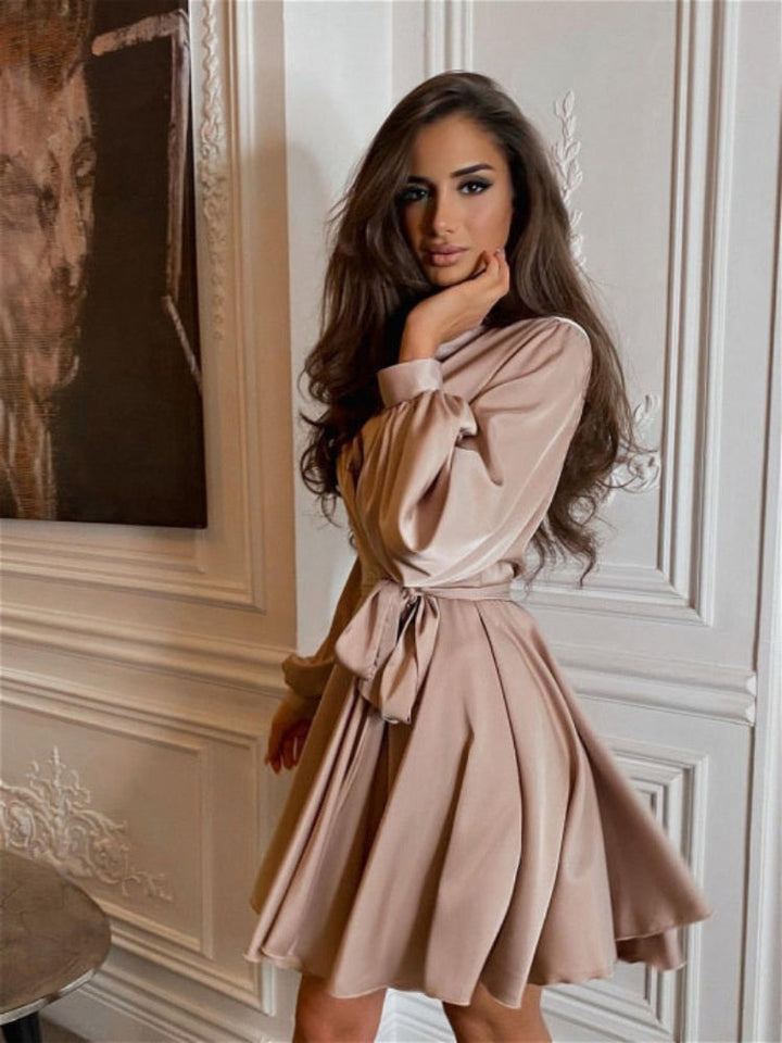 Rose gold elegant women's wrap mini dress. A stylish choice for cocktail parties & evenings.