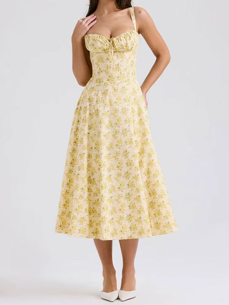 Elegant women's yellow floral midi dress. Perfect sleeveless summer vacation outfit, flowy and comfortable.