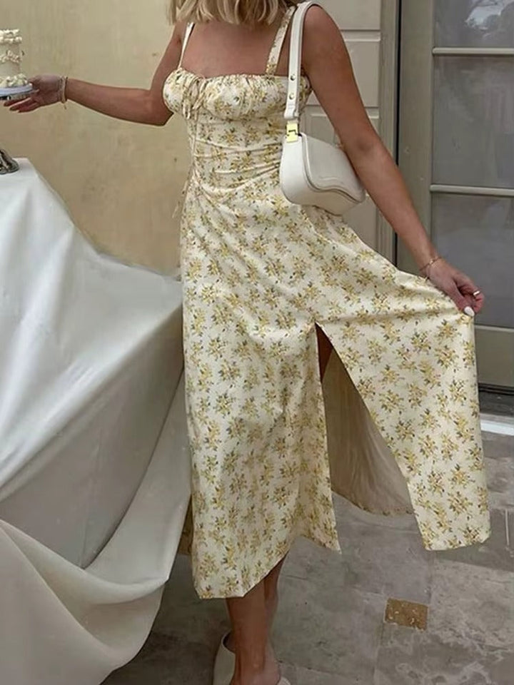 Women's strappy yellow floral midi dress. Flowy summer dress, perfect for elegant formal occasions or vacation.