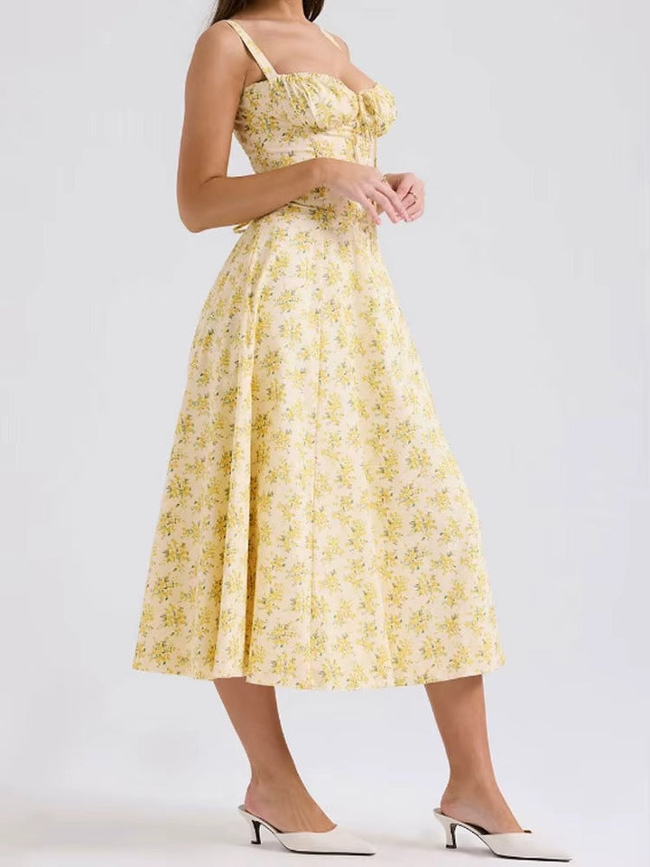Beautiful women's yellow floral summer midi dress. Sleeveless, elegant, and flowy, ideal for any occasion.