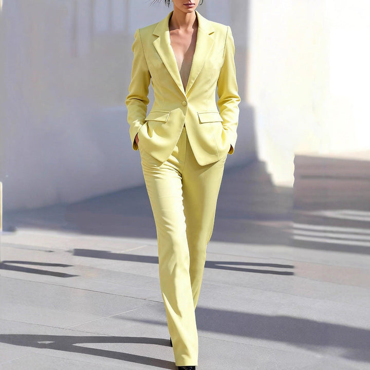 Elegant women's yellow tailored workwear co-ord set with blazer and straight-leg trousers for office attire.