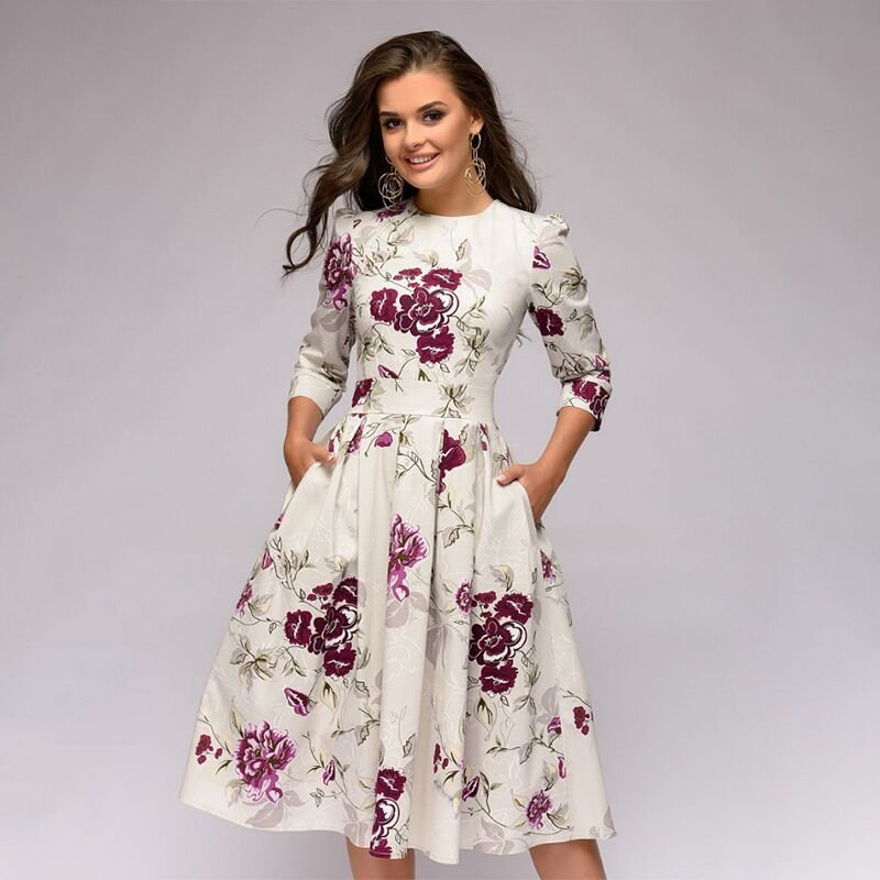 Women's A-line knee-length dress with a vibrant floral print, featuring 3/4 sleeves and a flattering fitted waist, ideal for spring occasions.