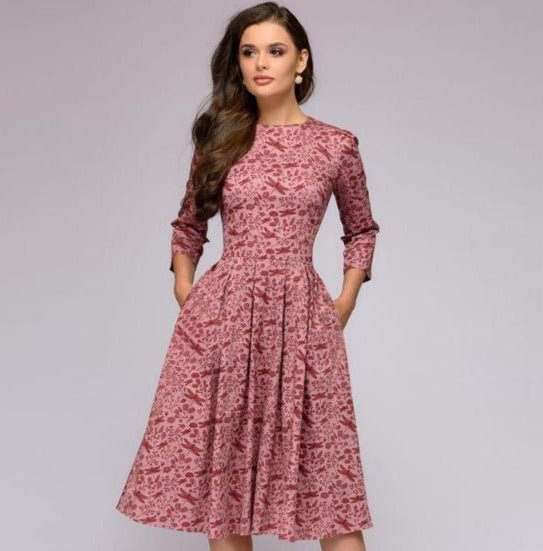 Women's A-line knee-length dress with a vibrant floral print, featuring 3/4 sleeves and a flattering fitted waist, ideal for spring occasions.