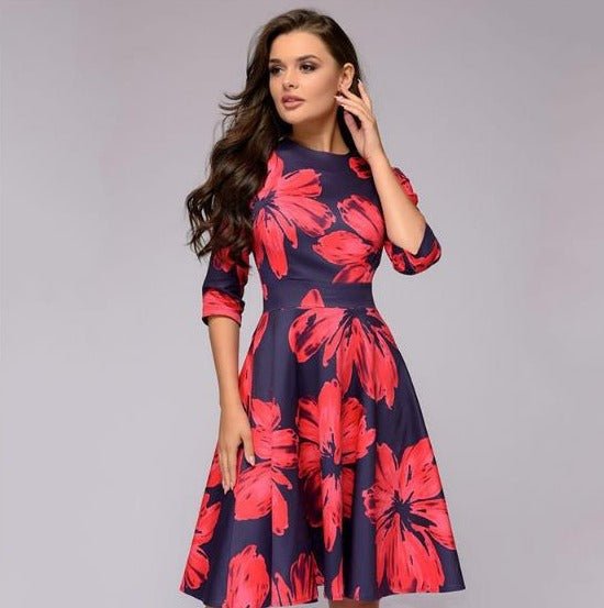 Women's A-line knee-length dress with a vibrant floral print, featuring 3/4 sleeves and a flattering fitted waist, ideal for spring occasions.