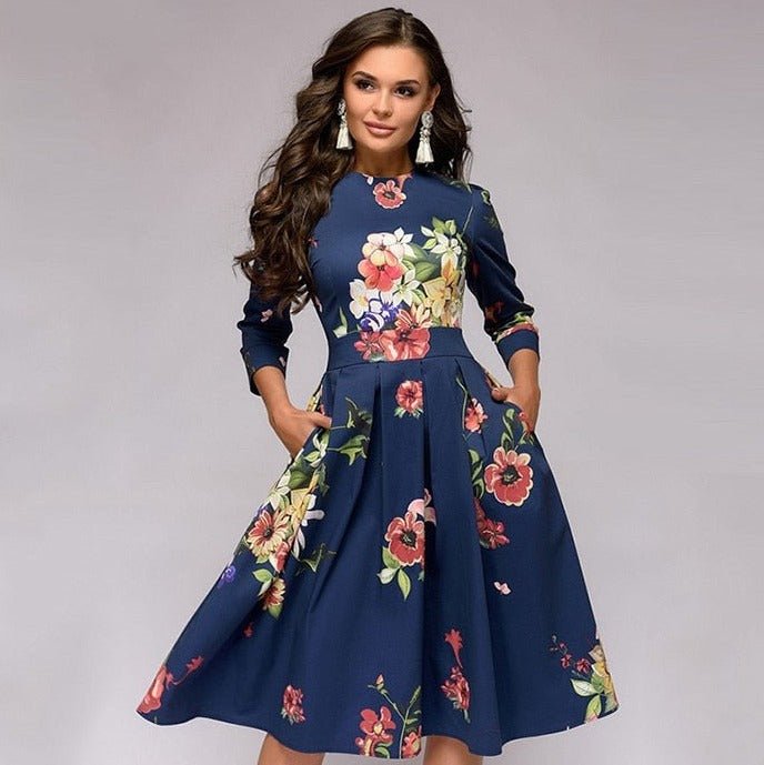 Women's A-line knee-length dress with a vibrant floral print, featuring 3/4 sleeves and a flattering fitted waist, ideal for spring occasions.