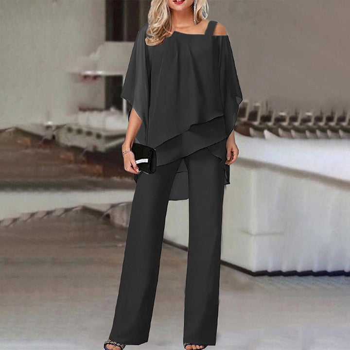 Elegant women's cold shoulder jumpsuit with flowy silhouette, featuring a chic design and flattering fit. Perfect for all occ