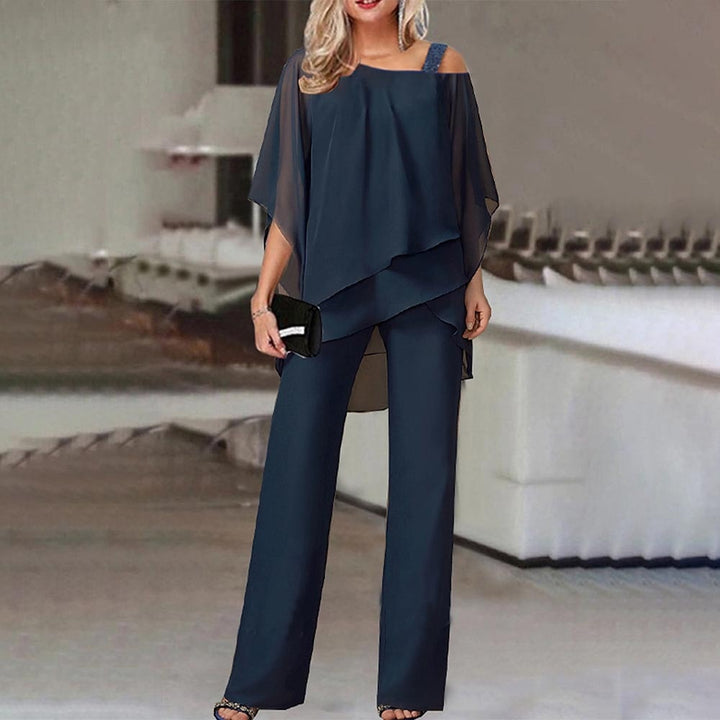 Elegant women's cold shoulder jumpsuit with flowy silhouette, featuring a chic design and flattering fit. Perfect for all occ