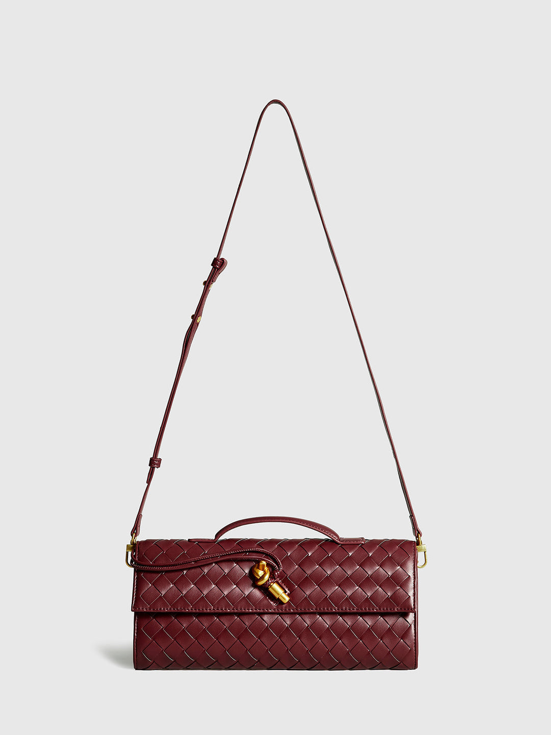Chic beige woven flap clutch handbag, an essential fashion accessory for modern women.