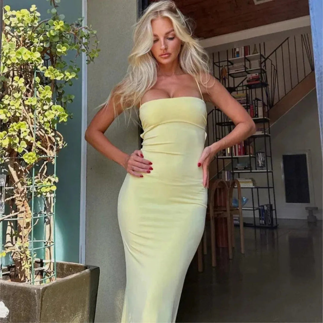 Sophisticated women's yellow backless bodycon maxi dress, a beautiful option for summer evening wear.