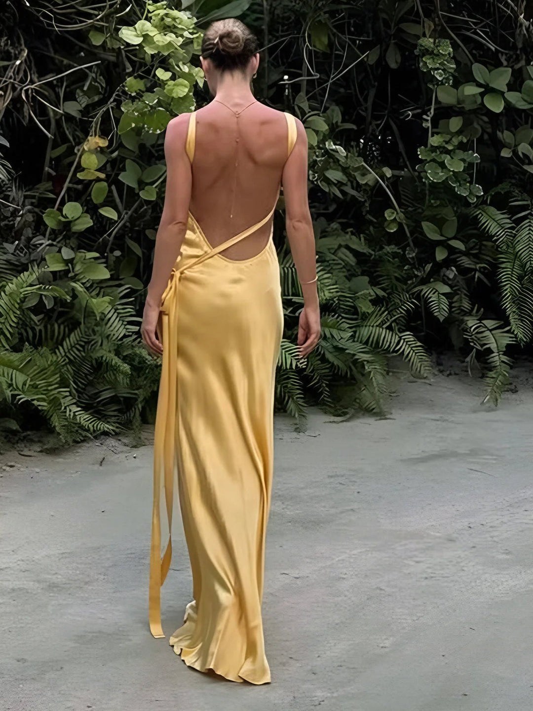 Vibrant yellow women's maxi dress, an elegant and sophisticated choice for wedding guests or special occasion formal wear.