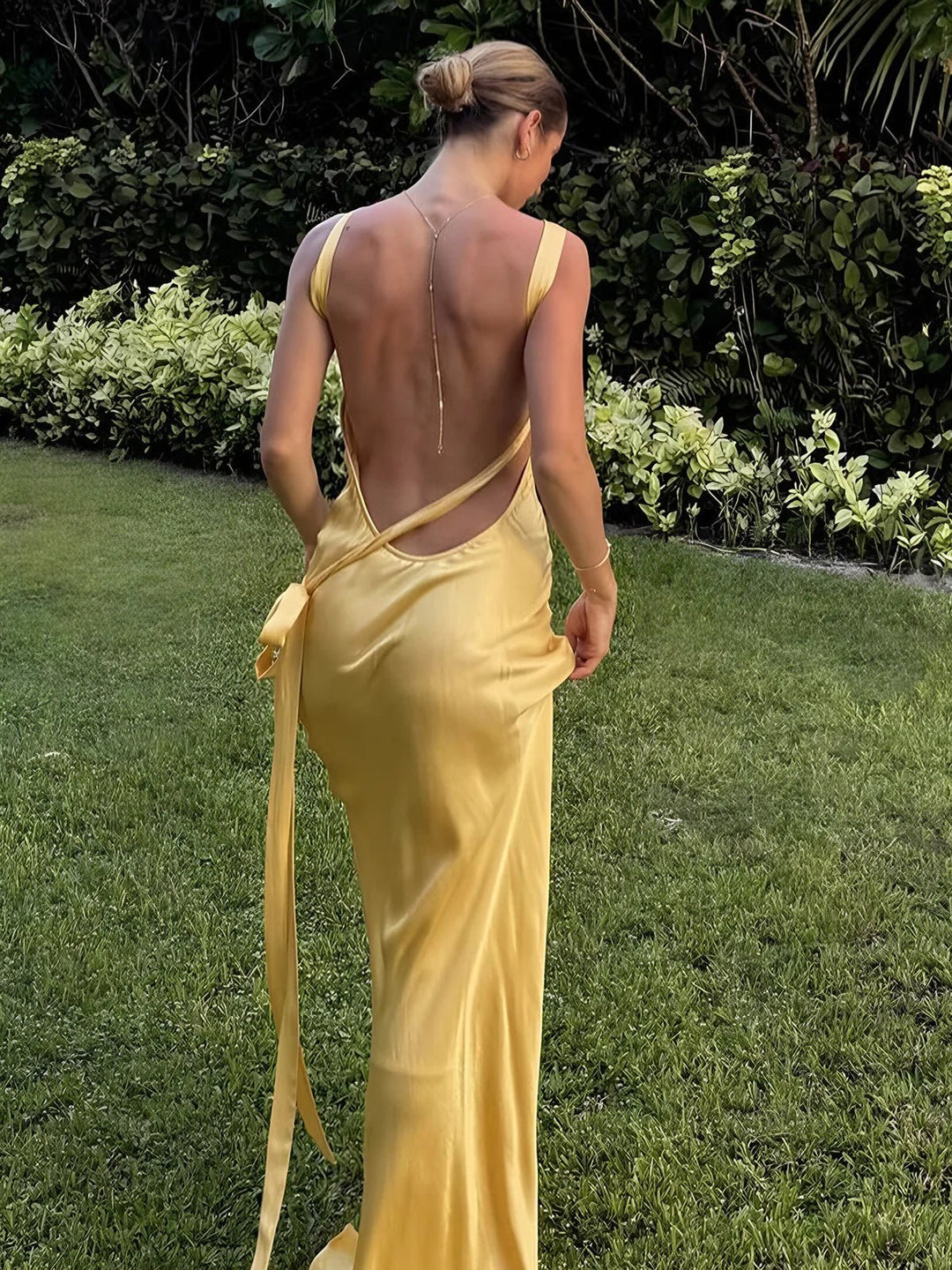 Sleek yellow women's maxi dress, an elegant and flattering asymmetrical gown perfect for wedding guests and formal occasions.