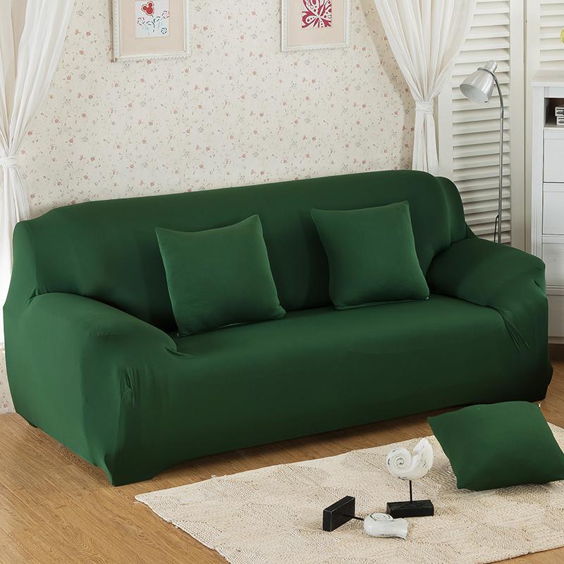 "Emerald green sofa cover on a couch, showcasing its stretchy and durable fabric, perfect for protection and style."