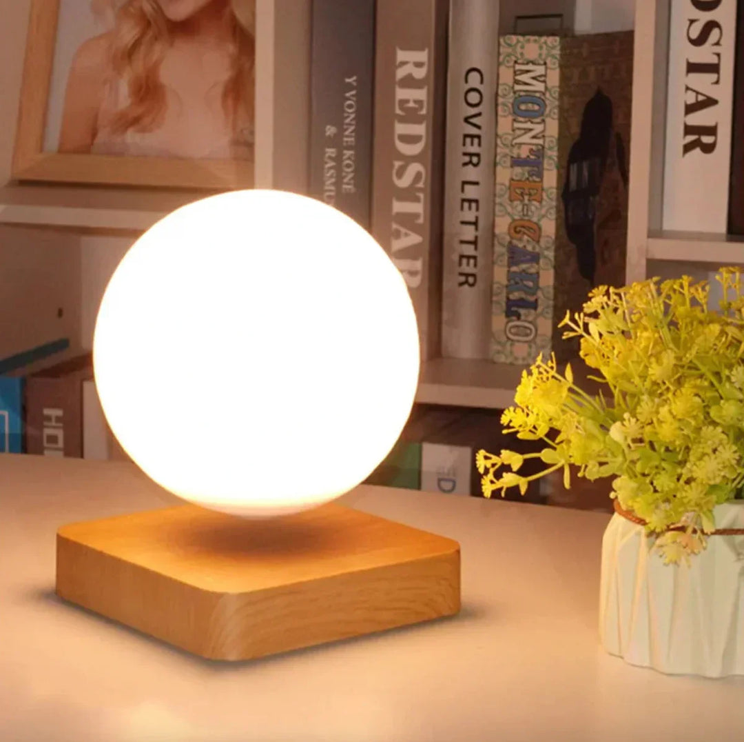 Enchanting levitating moon lamp, LunaFloat, emitting a soft ambient glow, perfect for modern home decor.