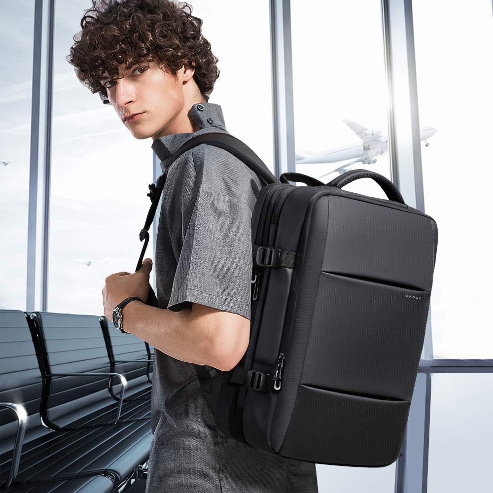 Padded handle & shoulder straps on waterproof travel backpack for comfortable carrying.