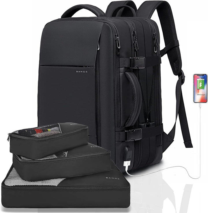Waterproof travel backpack placed next to a laptop, highlighting the dedicated sleeve.