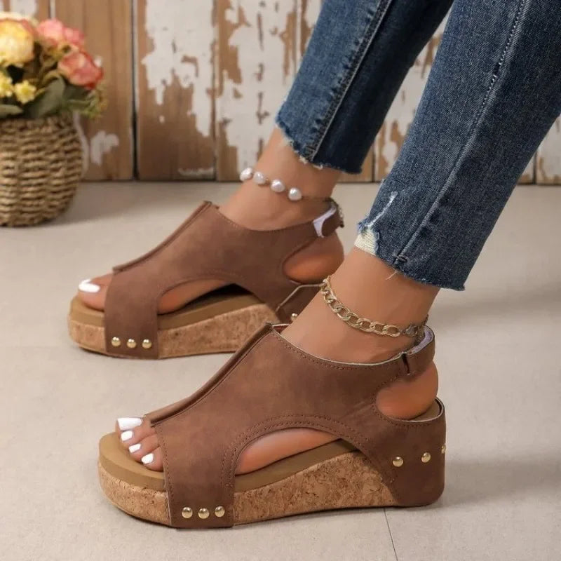 Fashionable women's wedge sandals with open toe and adjustable strap for comfortable summer wear, perfect for vacation.