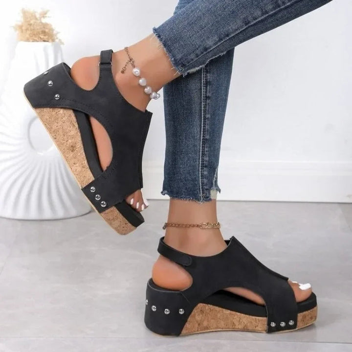 Comfortable women's wedge sandals with an adjustable ankle strap and soft material, ideal for casual summer wear.