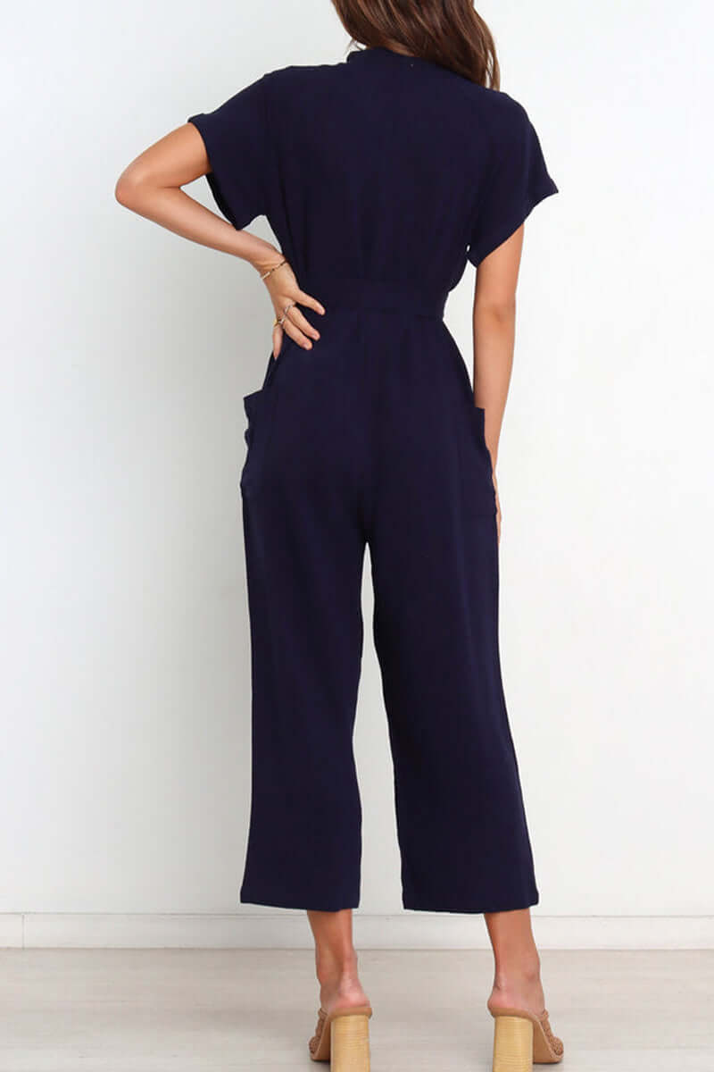 Elegant women's v-neck jumpsuit with functional buttons & a self-tie belt, a perfect one-piece for versatile styling.