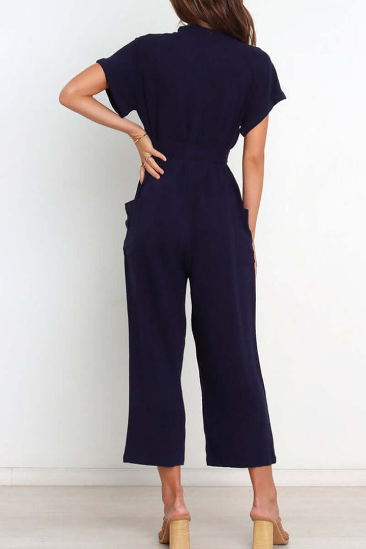 Elegant women's v-neck jumpsuit with functional buttons & a self-tie belt, a perfect one-piece for versatile styling.