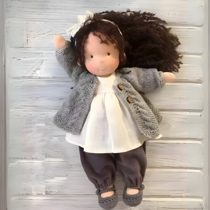 Sweet handmade Waldorf doll, an heirloom-quality cuddly toy for imaginative play.