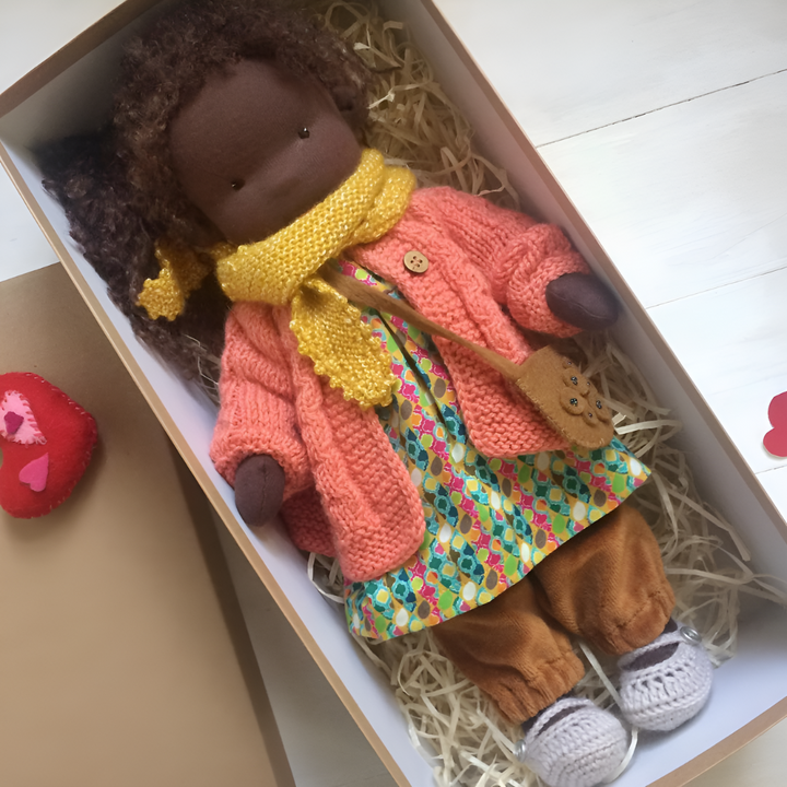 Ethically crafted Waldorf cuddly doll, promoting imaginative play and child development.